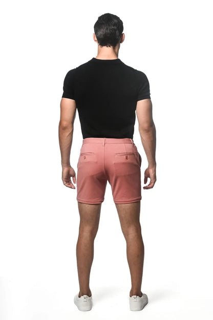 Crisp pink textured stretch knit chino shorts with tailored fit and subtle stitching details for casual wear