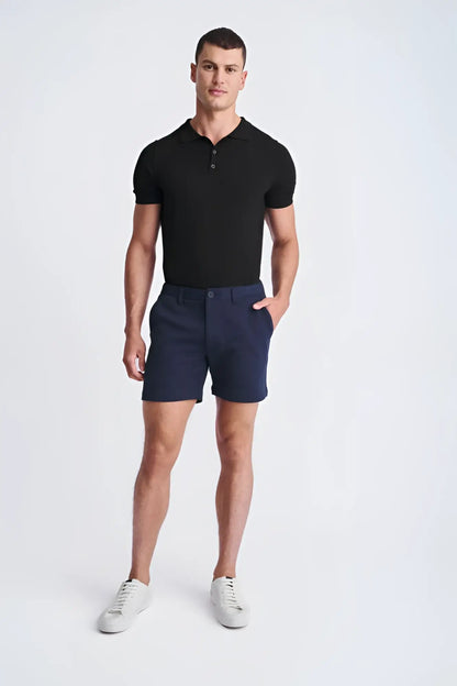 Navy blue textured stretch knit chino shorts with classic fit and button closure perfect for casual wear