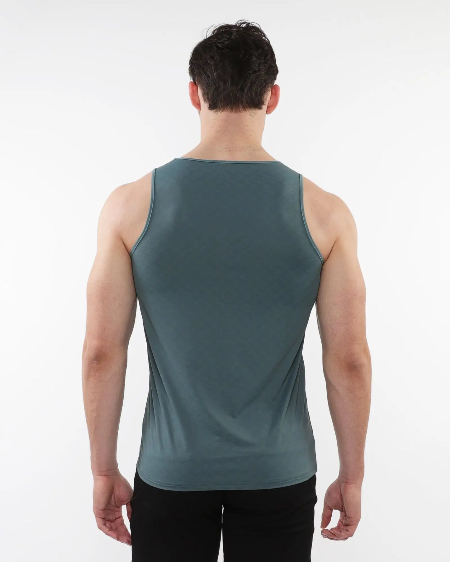 A sleek dark teal sleeveless textured stretch mesh performance tank with smooth form-fitting fabric