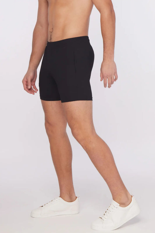 Black textured stretch performance shorts with sleek form-fitting design and subtle side pockets for athletic use