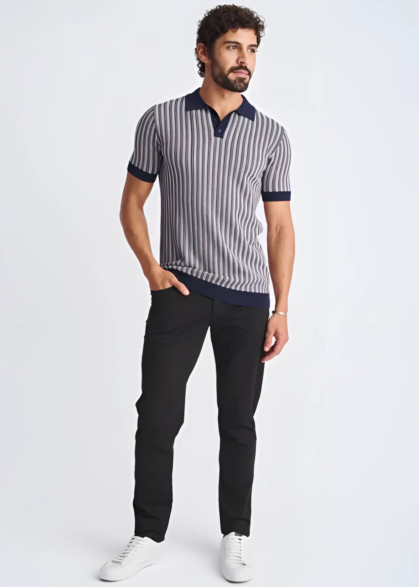 A man wearing a textured stripes silk tencel polo in navy and gray with dark blue collar cuffs and hem