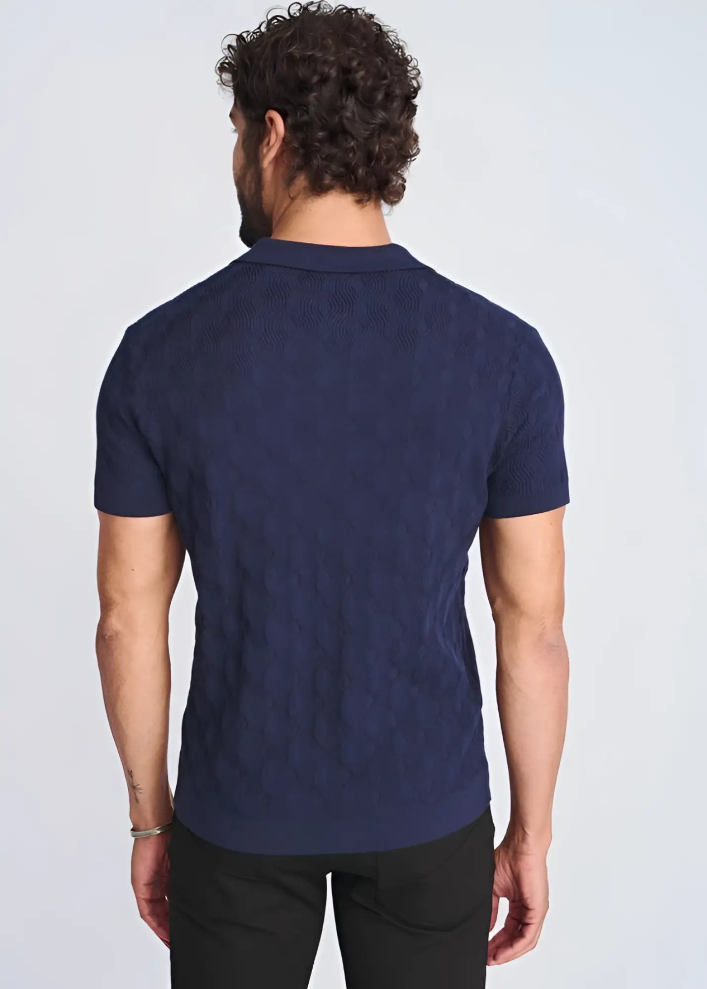 Navy blue cable-knit polo shirt featuring textured stripes made from silk and tencel for a refined look