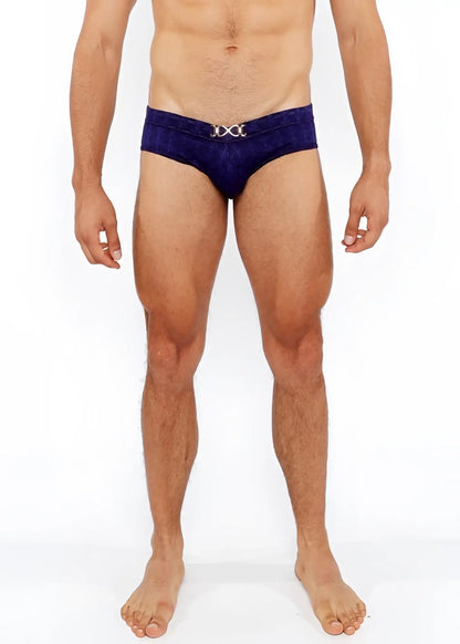 Deep blue velvet textured swim brief with a silver metallic x shaped front buckle for stylish swimwear
