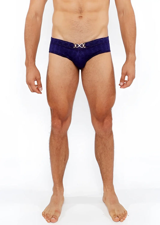 Deep blue velvet textured swim brief with a silver metallic x shaped front buckle for stylish swimwear