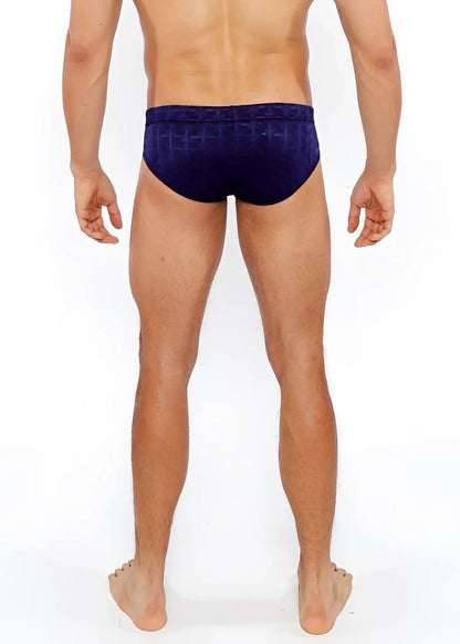 Navy blue textured swim brief with front buckle featuring a geometric pattern ideal for swimming and beachwear