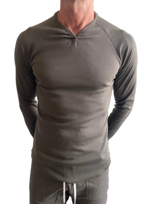 A sleek olive green thermal v neck long sleeve ribbed shirt with a fitted design for warmth and style