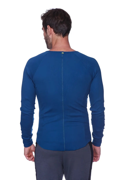 Thermal v-neck long sleeve royal blue athletic shirt with ribbed neckline and back zipper shown from the back side