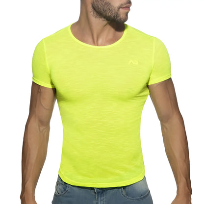 Bright neon yellow thin flame t-shirt with short sleeves subtle textured fabric and small chest logo