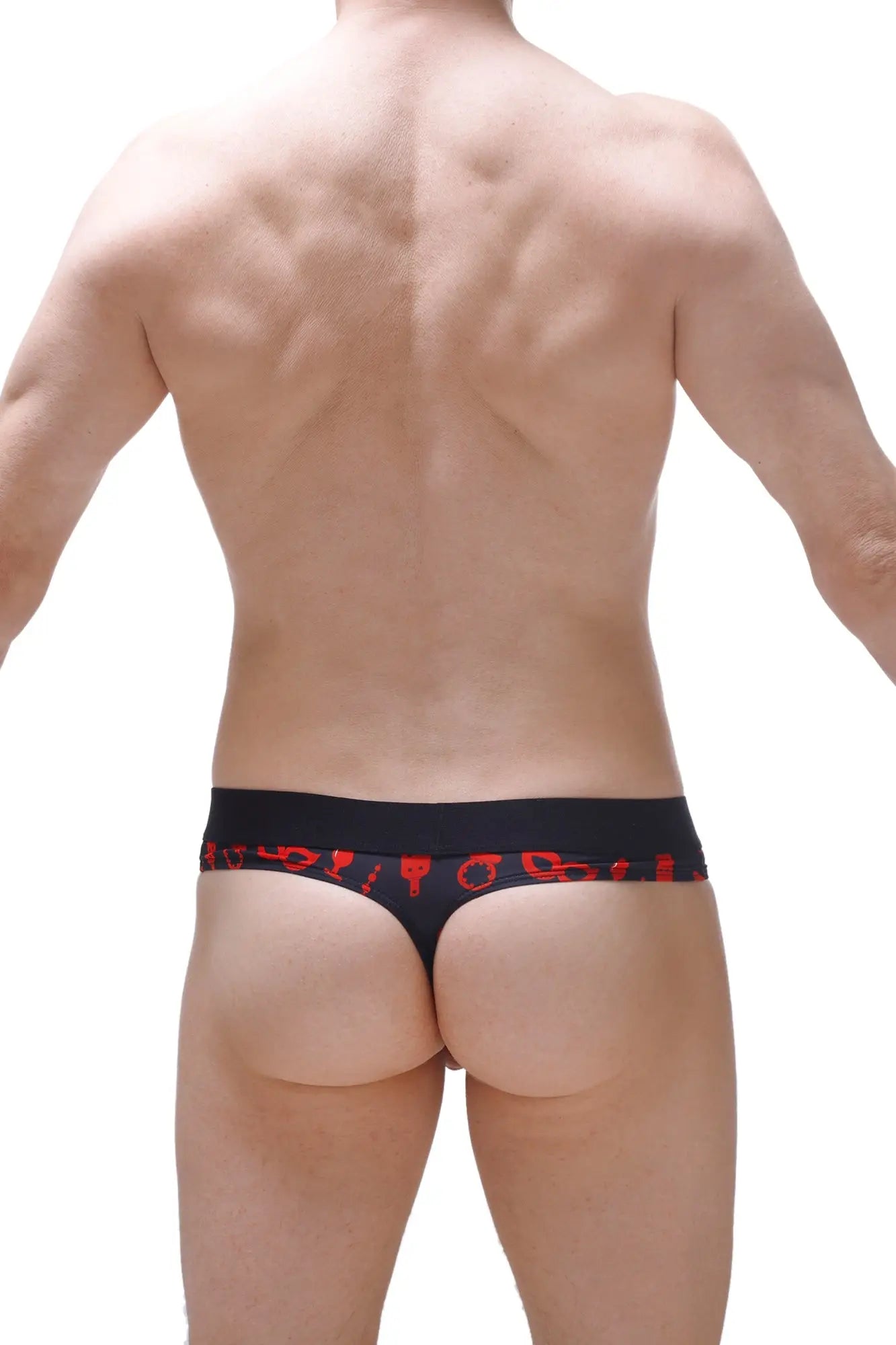 Black thong with red symbolic waistband patterns featuring a hole cockring for boudoir use back view
