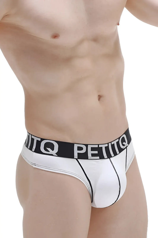White petitq thong with pad made from modal fabric featuring a black waistband with bold white brand lettering