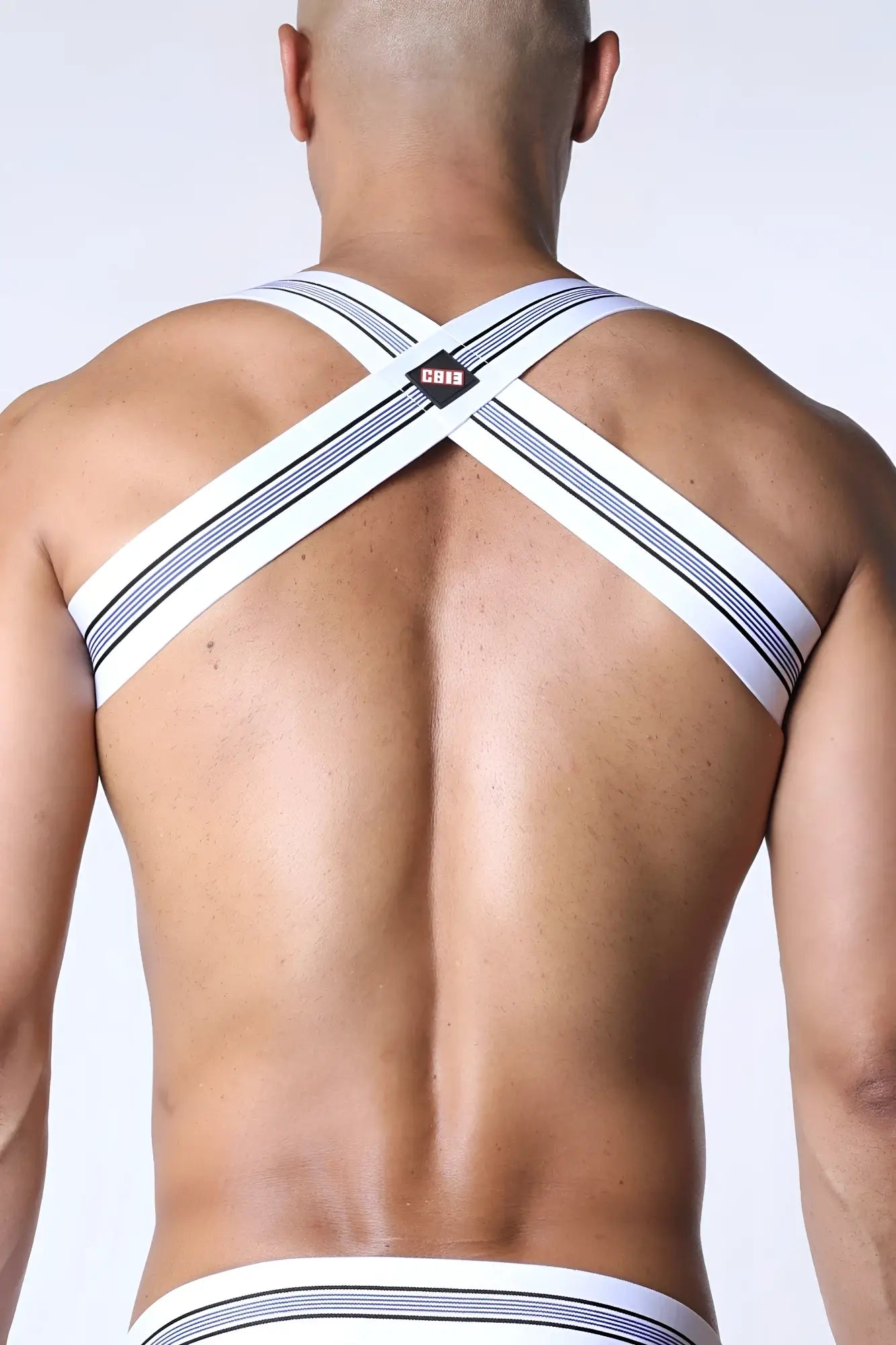 White and navy striped cross-back men’s tight end elastic harness underwear with small black logo patch at center back