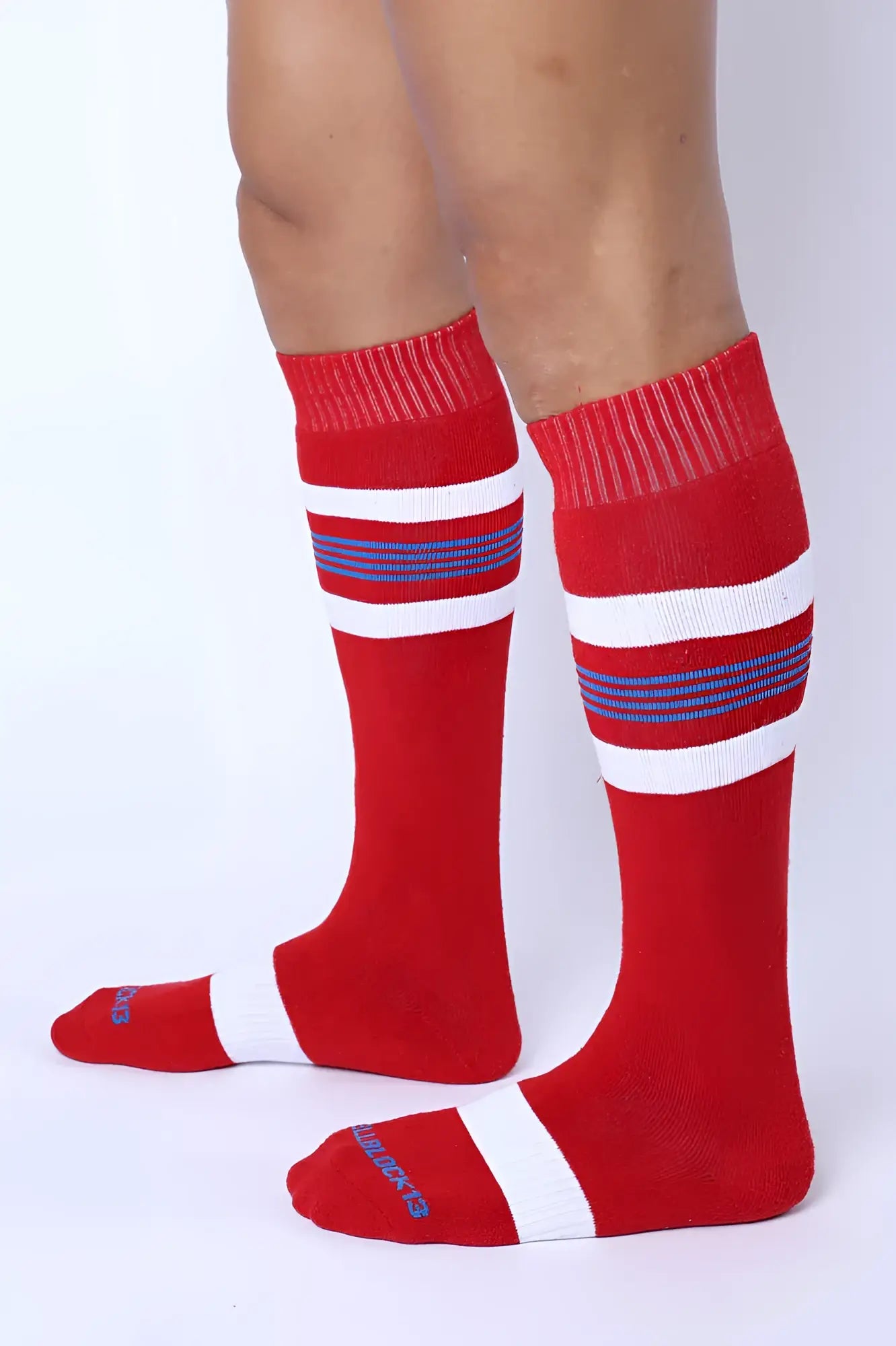 Tight End knee high socks in red with white and navy blue stripes featuring ribbed cuff and toe detailing