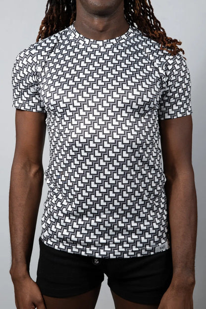 Black and white geometric-patterned short-sleeve rash guard tile print tee for sun protection and water sports