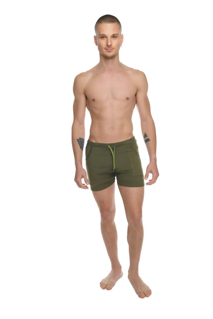 Olive green transition yoga shorts with contrasting lime green drawstring designed for athletic use
