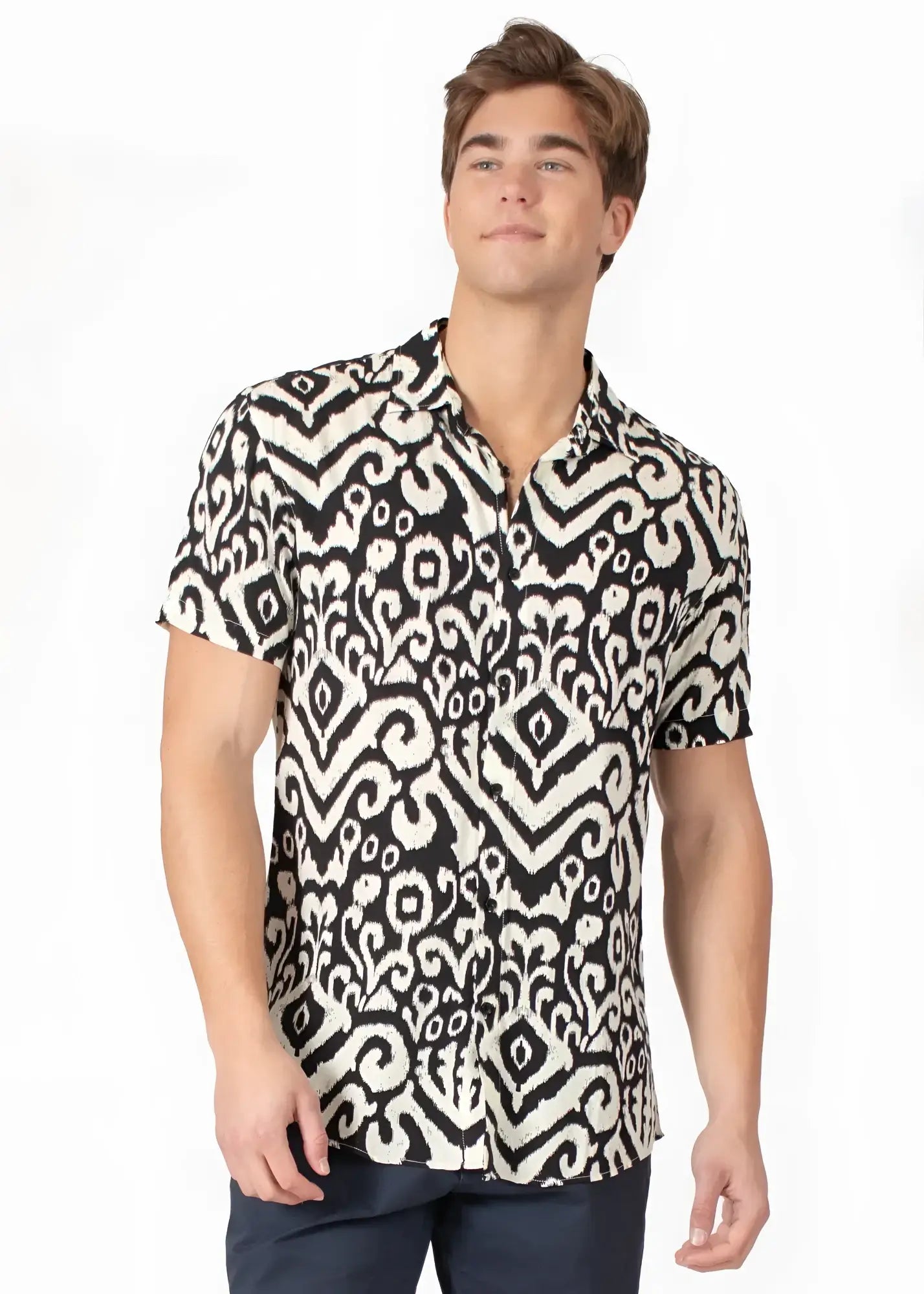 Black and white short-sleeved button-up tribal abstract s slash s shirt with intricate ikat design pattern