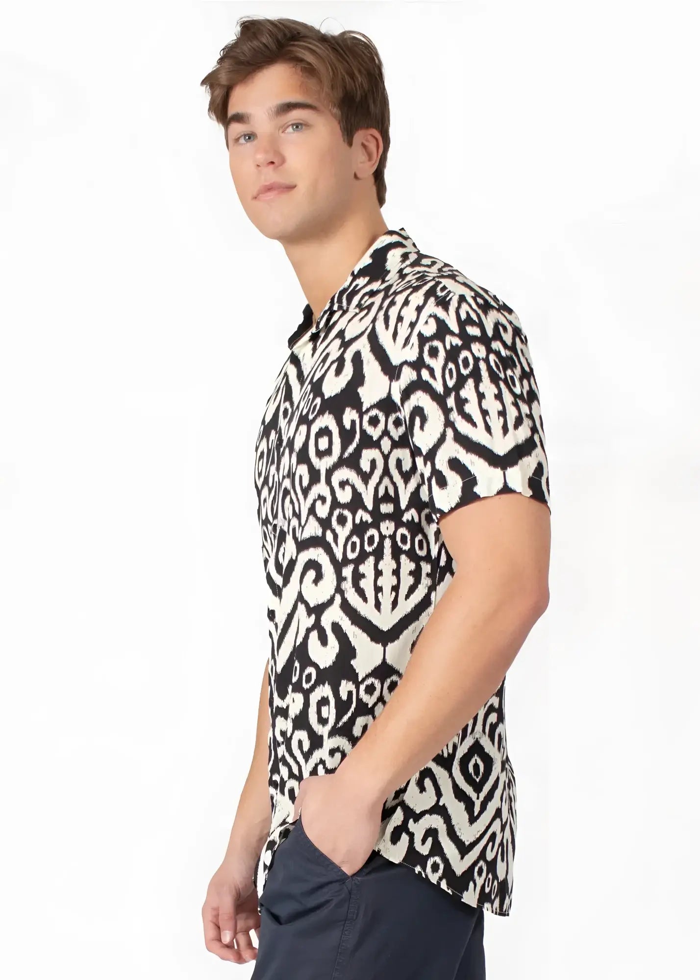 Black and white tribal abstract short-sleeved button-up shirt with intricate ikat pattern for casual wear