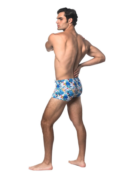 Blue floral-patterned tropics printed swim trunks made of lightweight fabric for comfortable beachwear