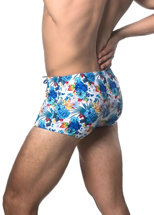 Blue and multicolored tropical floral printed swim trunk featuring vibrant patterns perfect for beachwear
