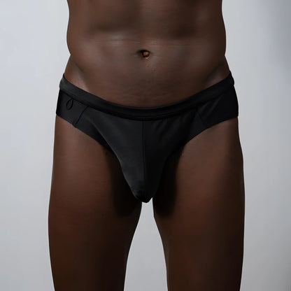 Tulio bikini brief solid black sleek form-fitting swim trunks with smooth fabric finish for swimming and sunbathing