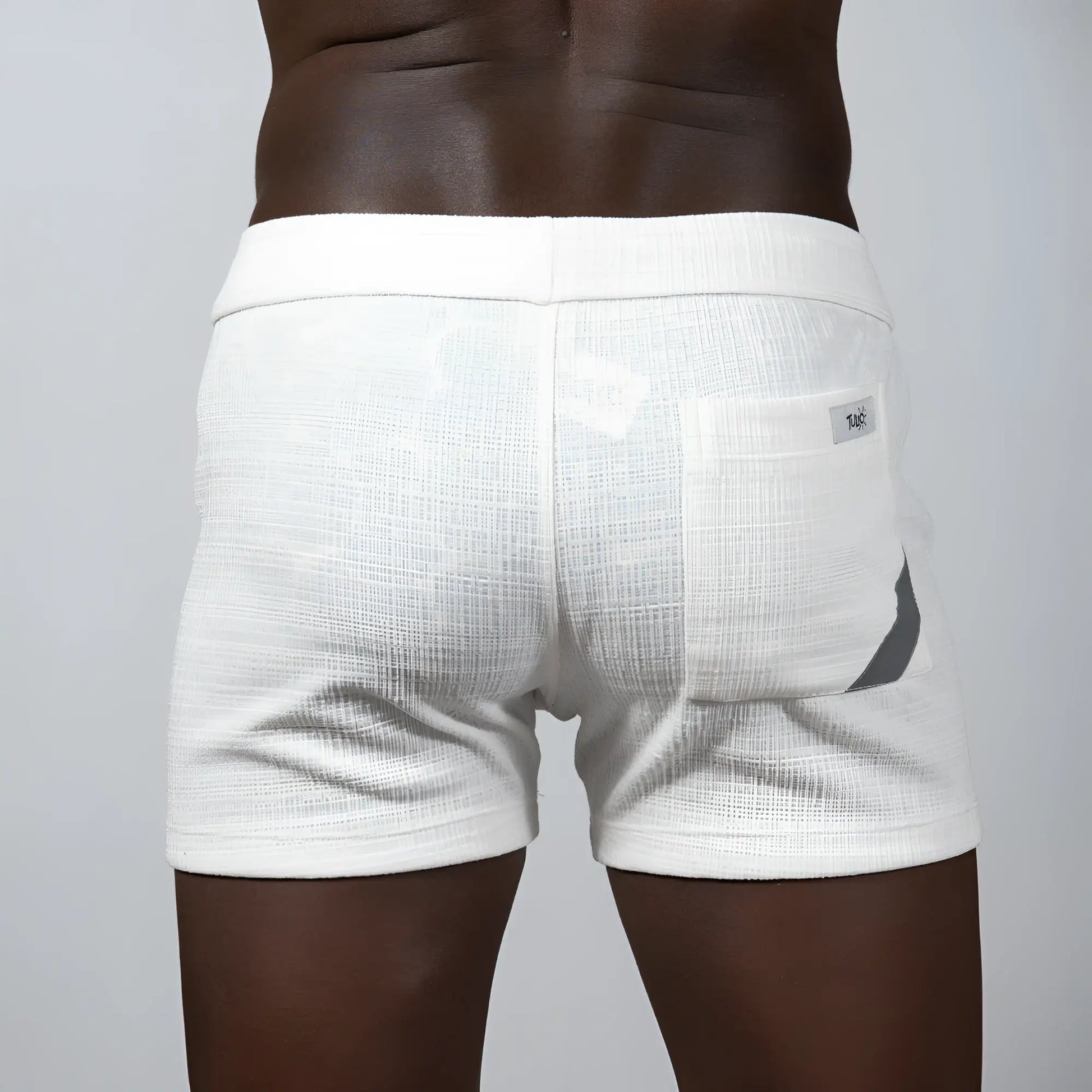 White tulio linen texture shorts featuring a subtle gray accent on the side pocket and a breathable fabric design