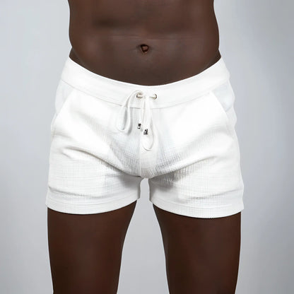 White textured linen shorts with drawstring waistband and subtle horizontal ribbing from tulio linen texture shorts assortment