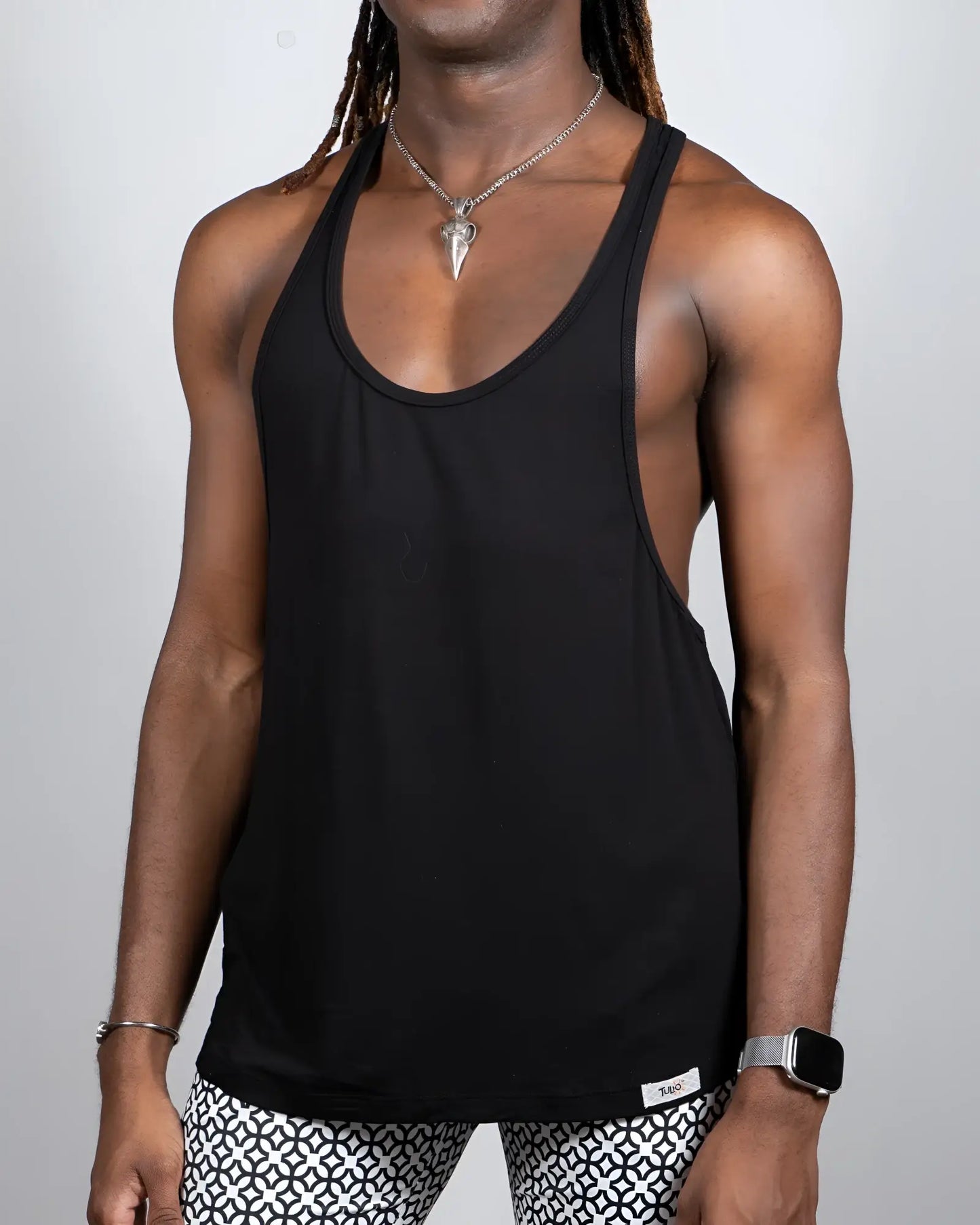 Black tulio racerback tank top with minimalist design showing the back side in a comfortable lightweight fabric
