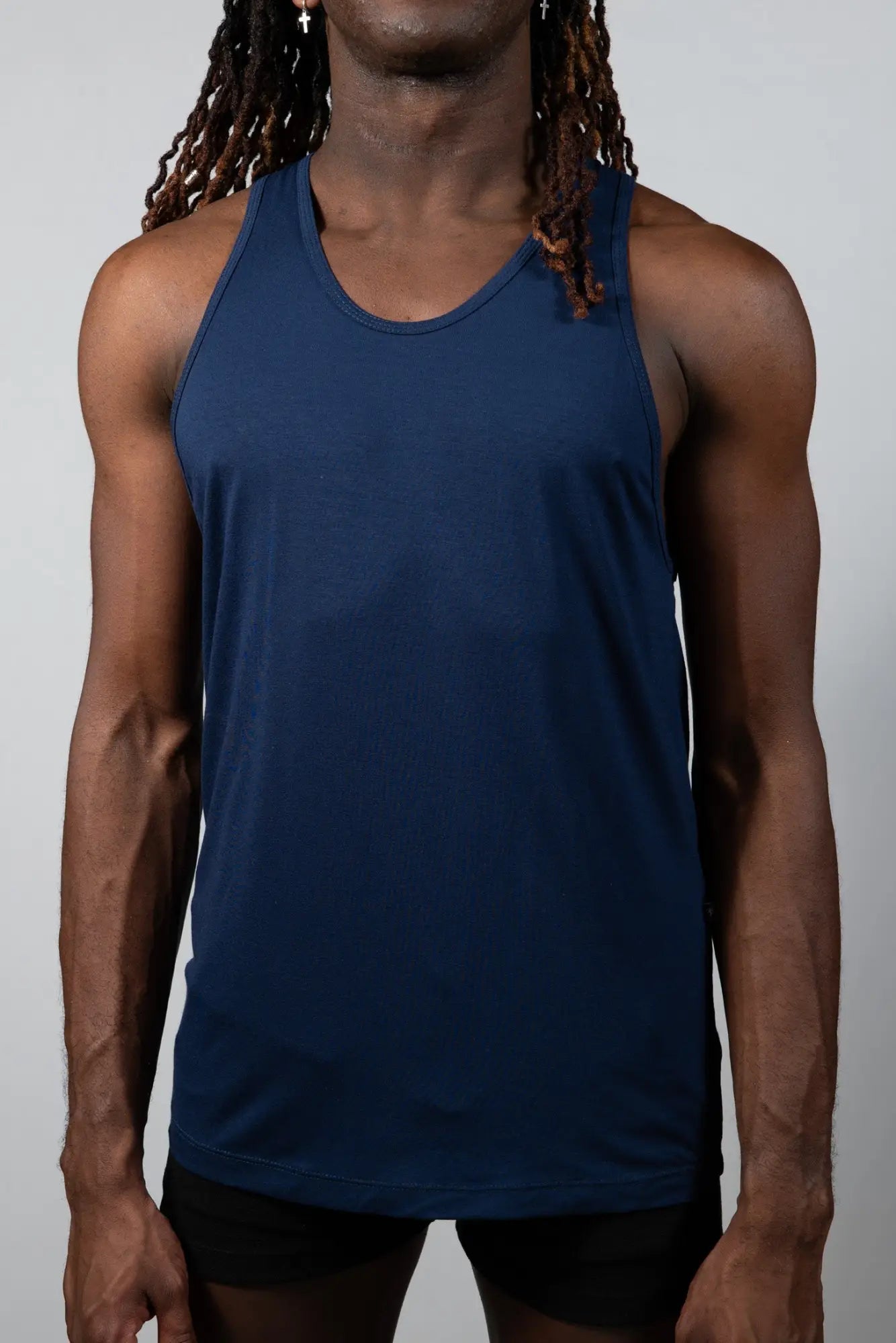 Tulio solid tank navy blue sleeveless athletic top with rounded neckline and smooth stretchy fabric