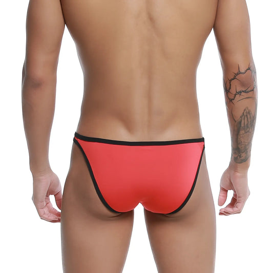 Bright red form-fitting u-station calypso bikini swim trunks with black trim on waistband and leg openings