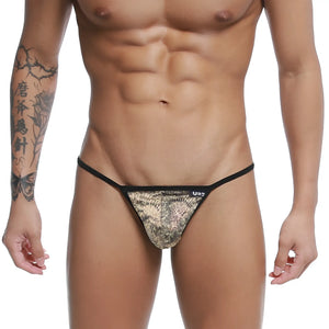 Black and gold patterned u-station string thong with sleek modern design and peacock motif in front view