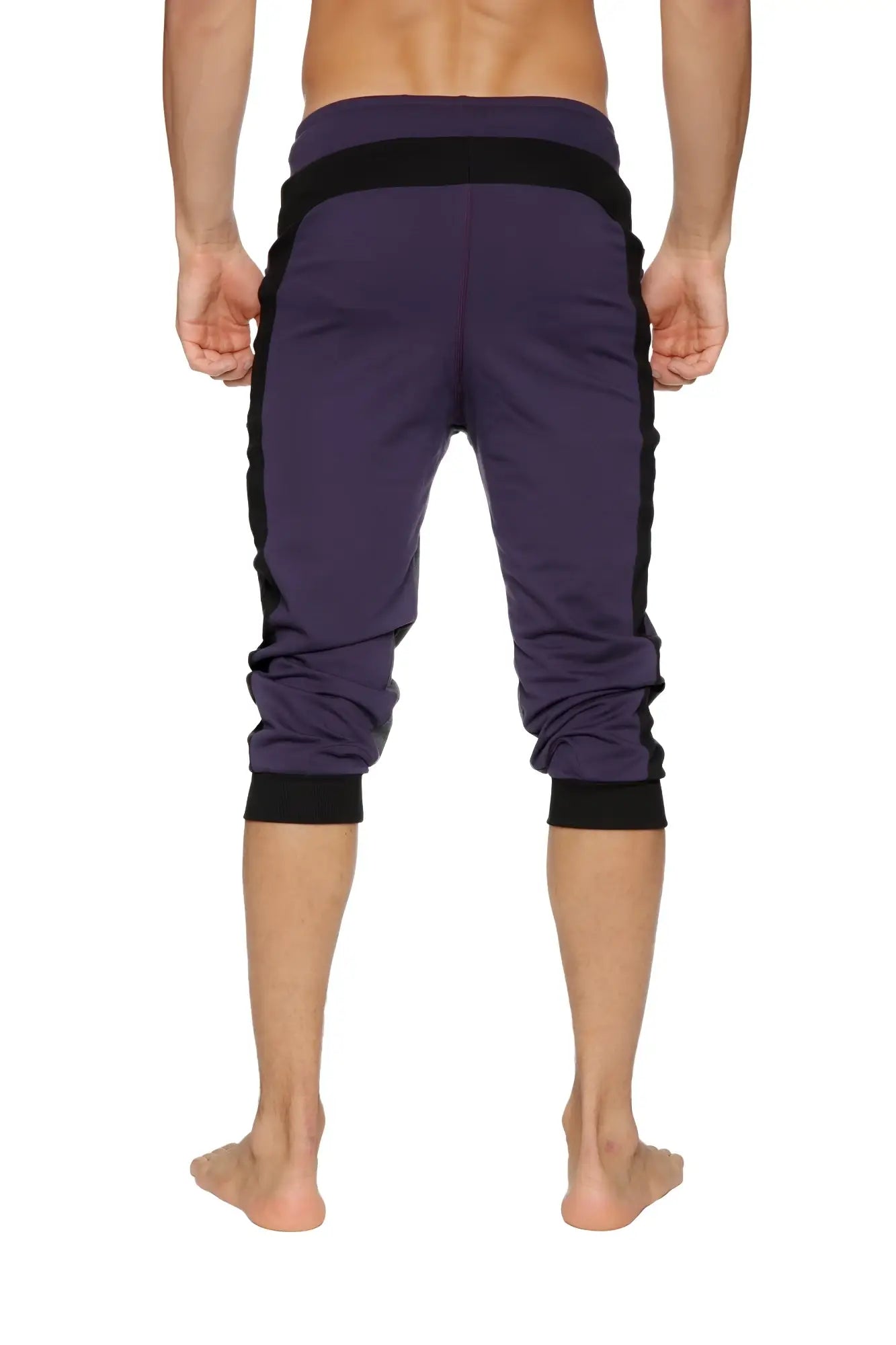 Purple Ultra-Flex tri-color cuffed yoga capris with black side panels and elastic cuffs for athletic use