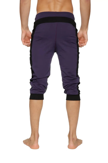 Purple Ultra-Flex tri-color cuffed yoga capris with black side panels and elastic cuffs for athletic use