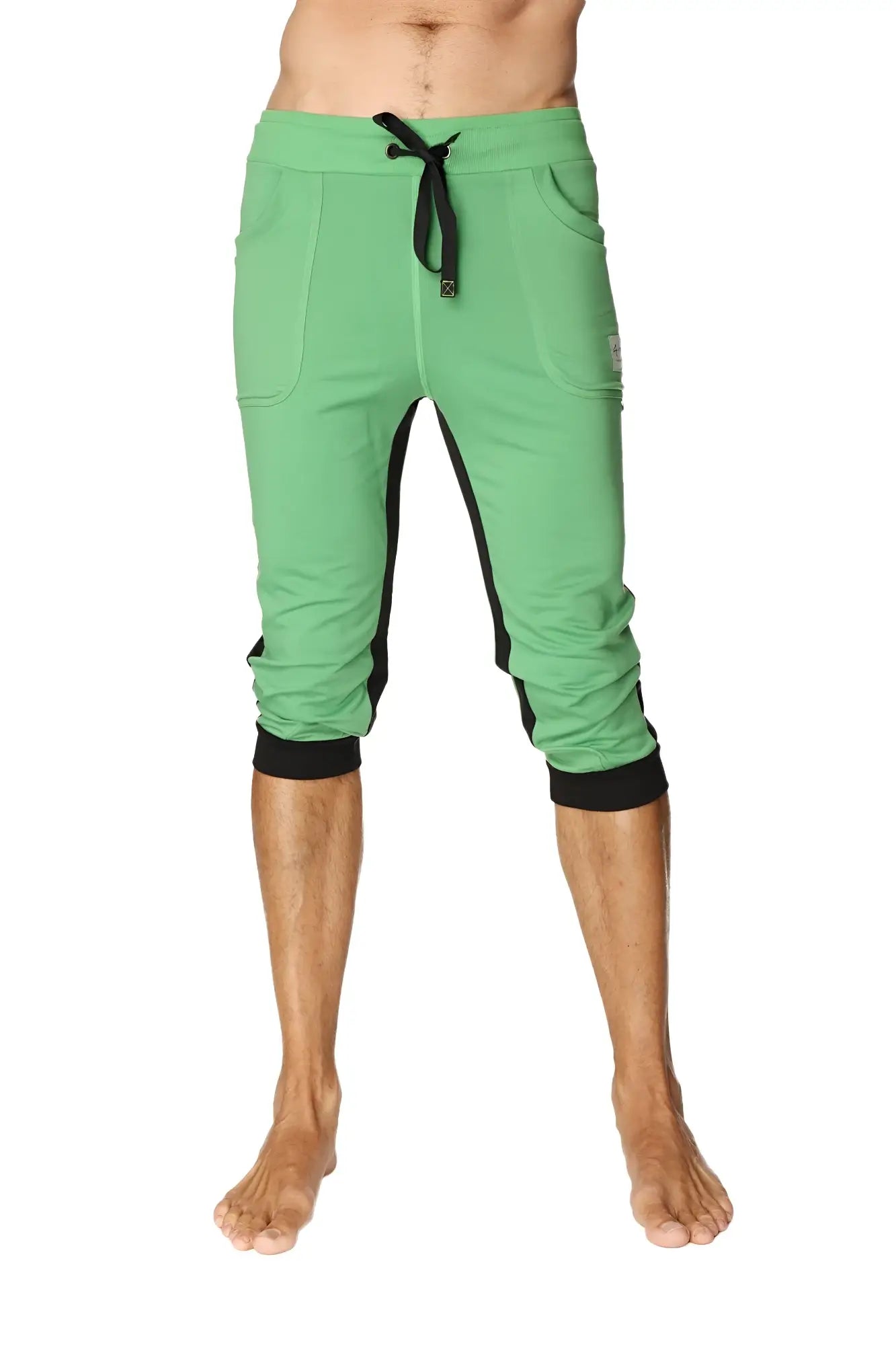 Green ultra-flex tri-color cuffed yoga pant with black side panels and elastic cuffs in capri length