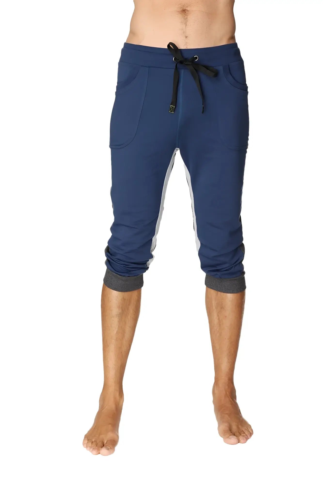 Navy blue ultra-flex tri-color cuffed yoga pant with white side panels and black drawstring waistband in capri length