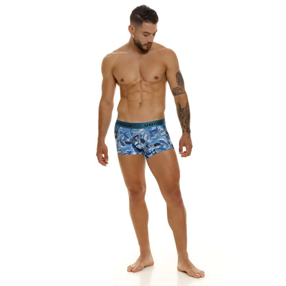 Unico 23080100106 Atlantida trunks are blue patterned boxer briefs with a teal waistband featuring the Unico brand