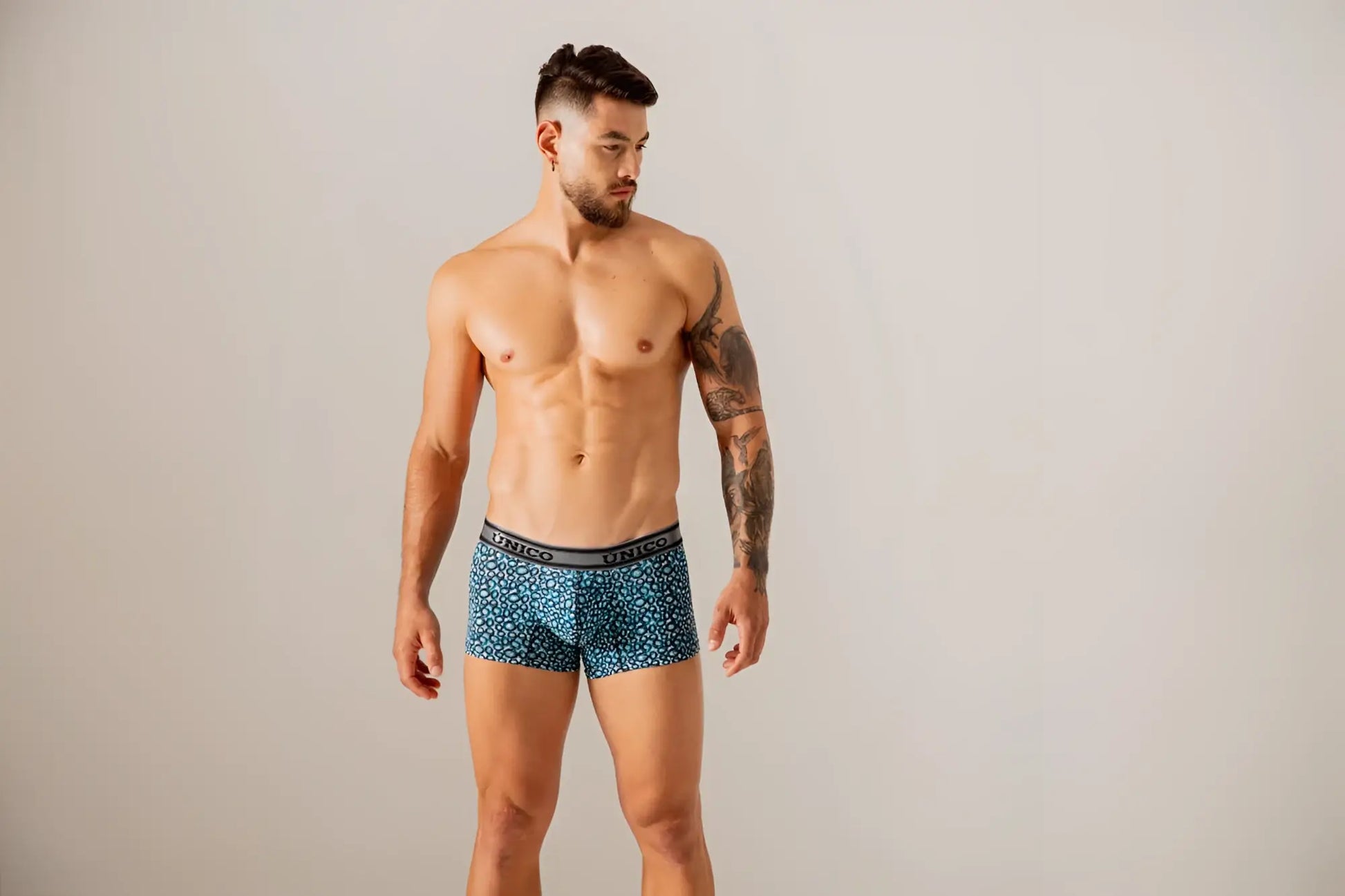 Unico 24020100110 redondel blue patterned men’s boxer briefs with black elastic waistband and unico branding