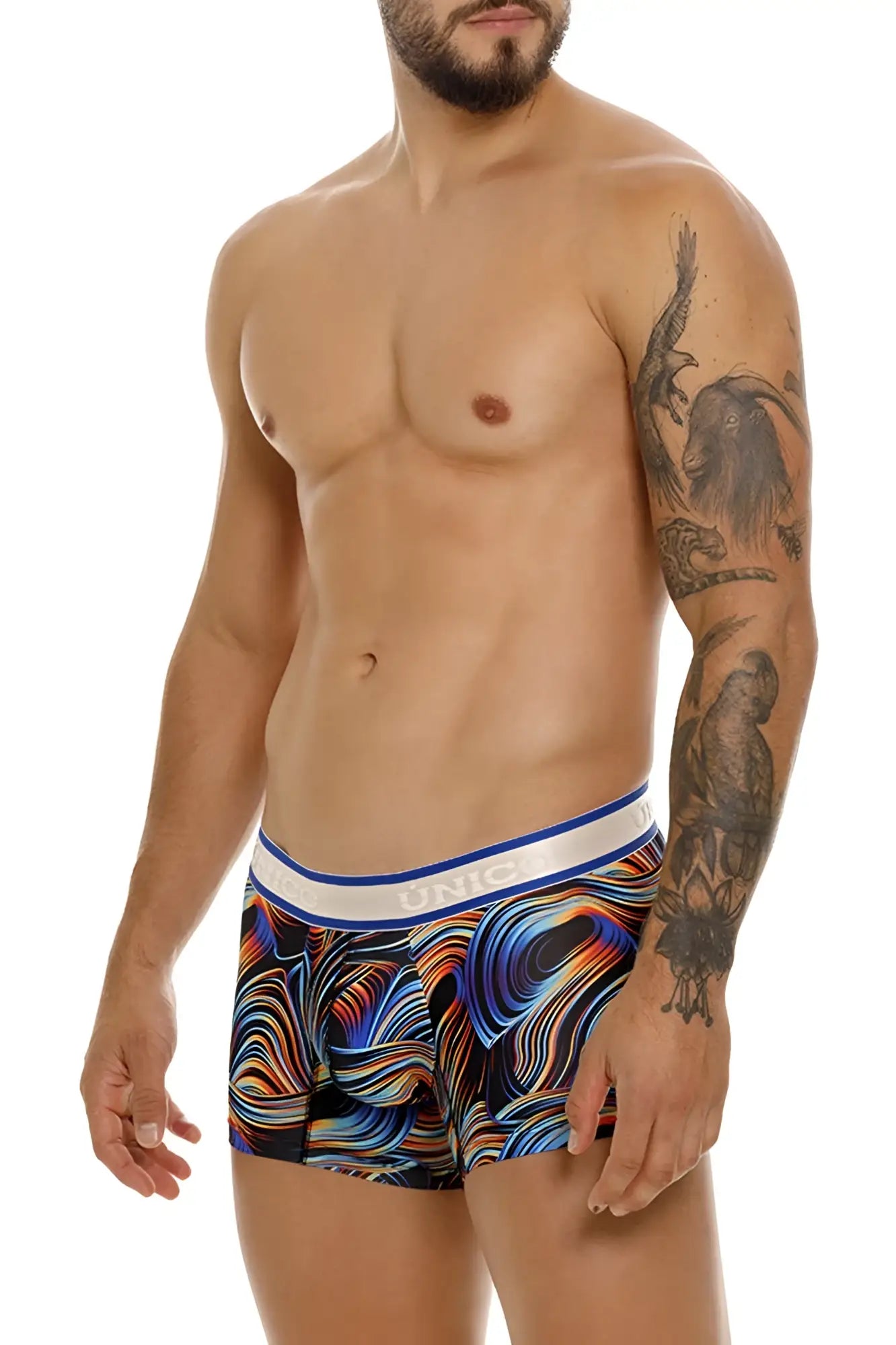 Vibrant abstract wave-patterned unico 24100100104 calamo trunks in bold blues oranges purples with white unic waistband