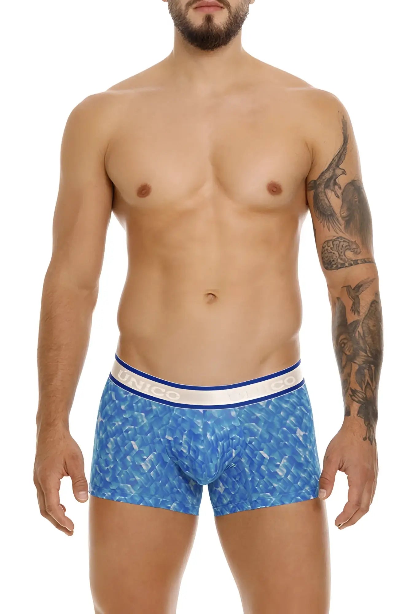 Blue patterned Unico 24100100106 Palindromo trunks with white and blue waistband featuring the brand name