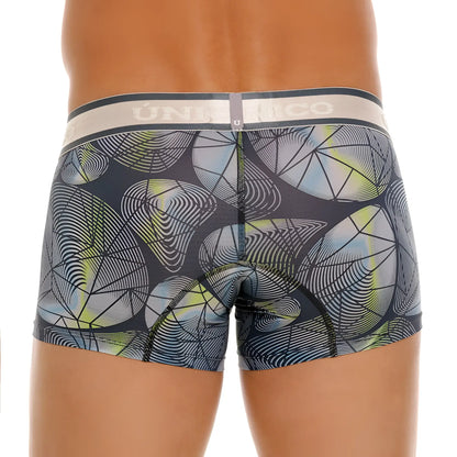 Dark gray unico resplandecer trunks featuring a modern geometric pattern with light blue lime green and white circles