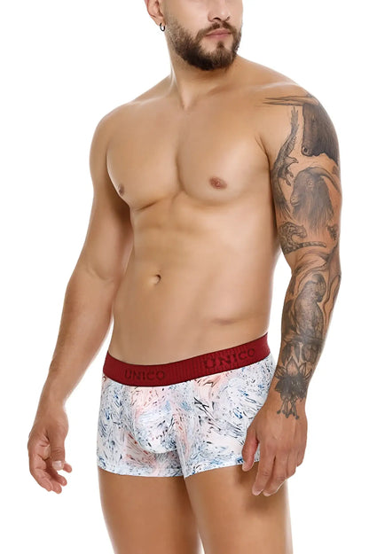 White boxer briefs with a marbled pink blue and gray pattern and a solid red unico branded waistband