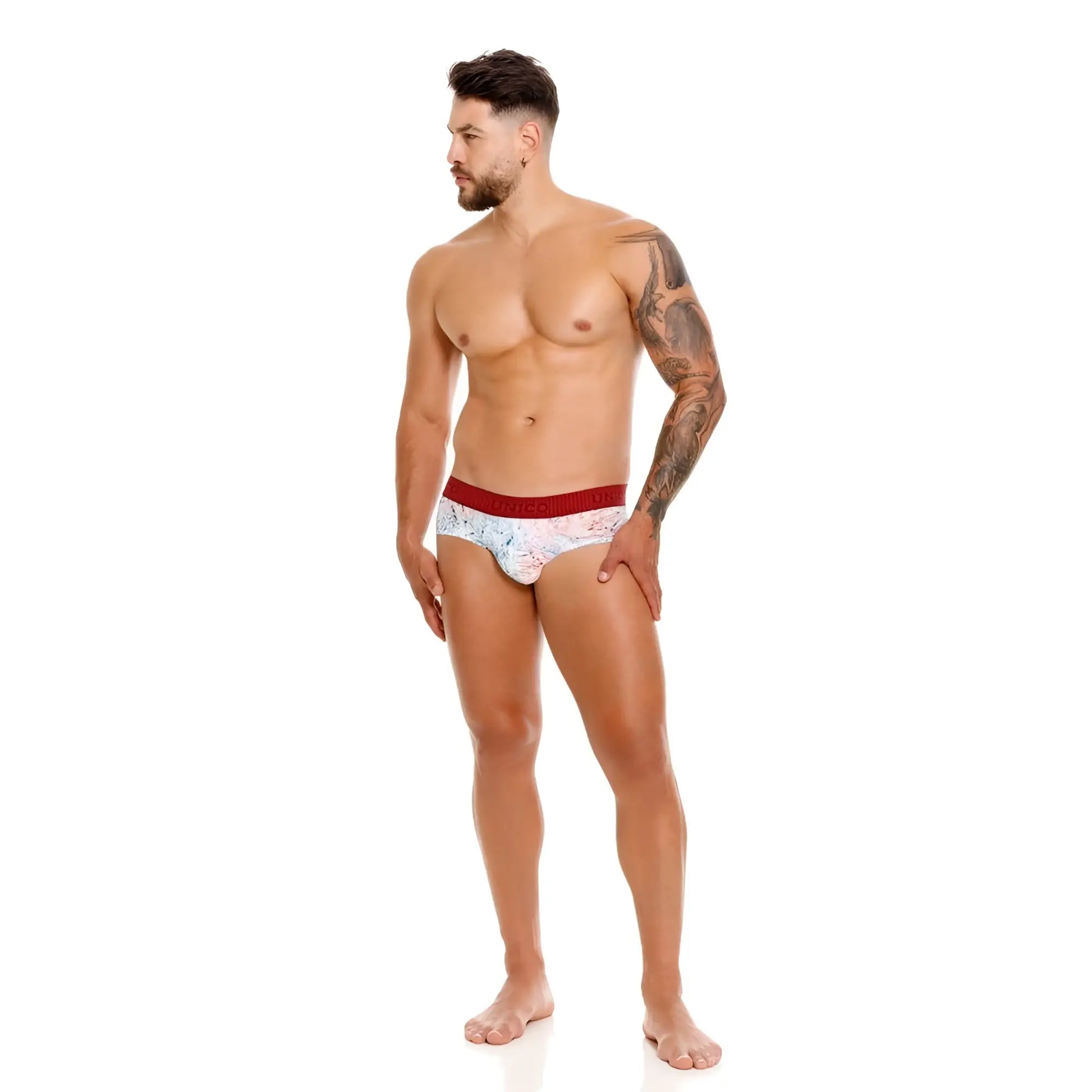 White patterned Unico Rizo briefs with a red waistband featuring a soft textured fabric for comfortable wear