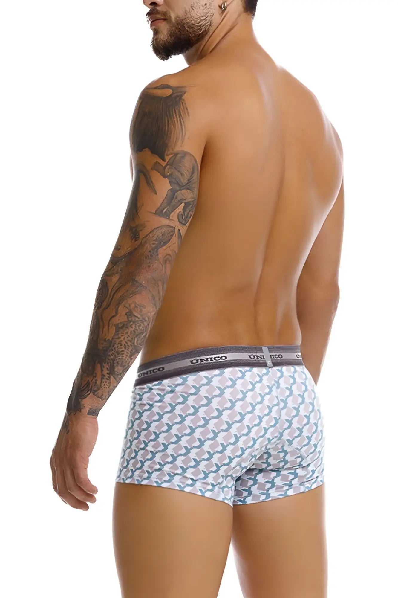 White briefs with teal and gray geometric pattern and dark gray unico branded waistband featured in unico 25040100115 caterva trunks color 43-printed