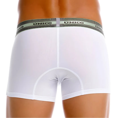 White unico boxer briefs with a gray elastic waistband featuring unico branding in black lettering, color white