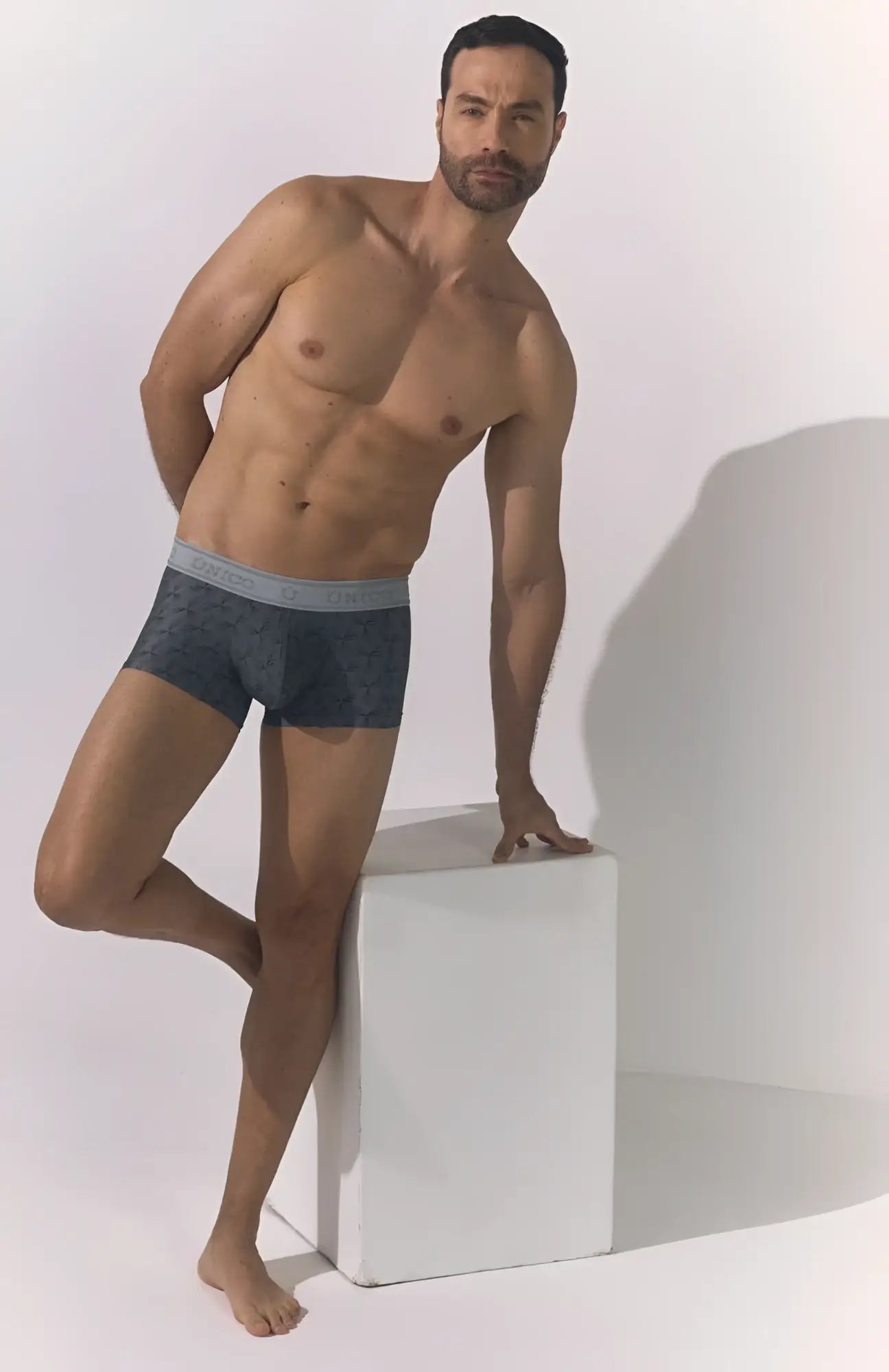 Dark gray unico 25050100103 chisell trunks with subtle textured pattern and solid light gray waistband