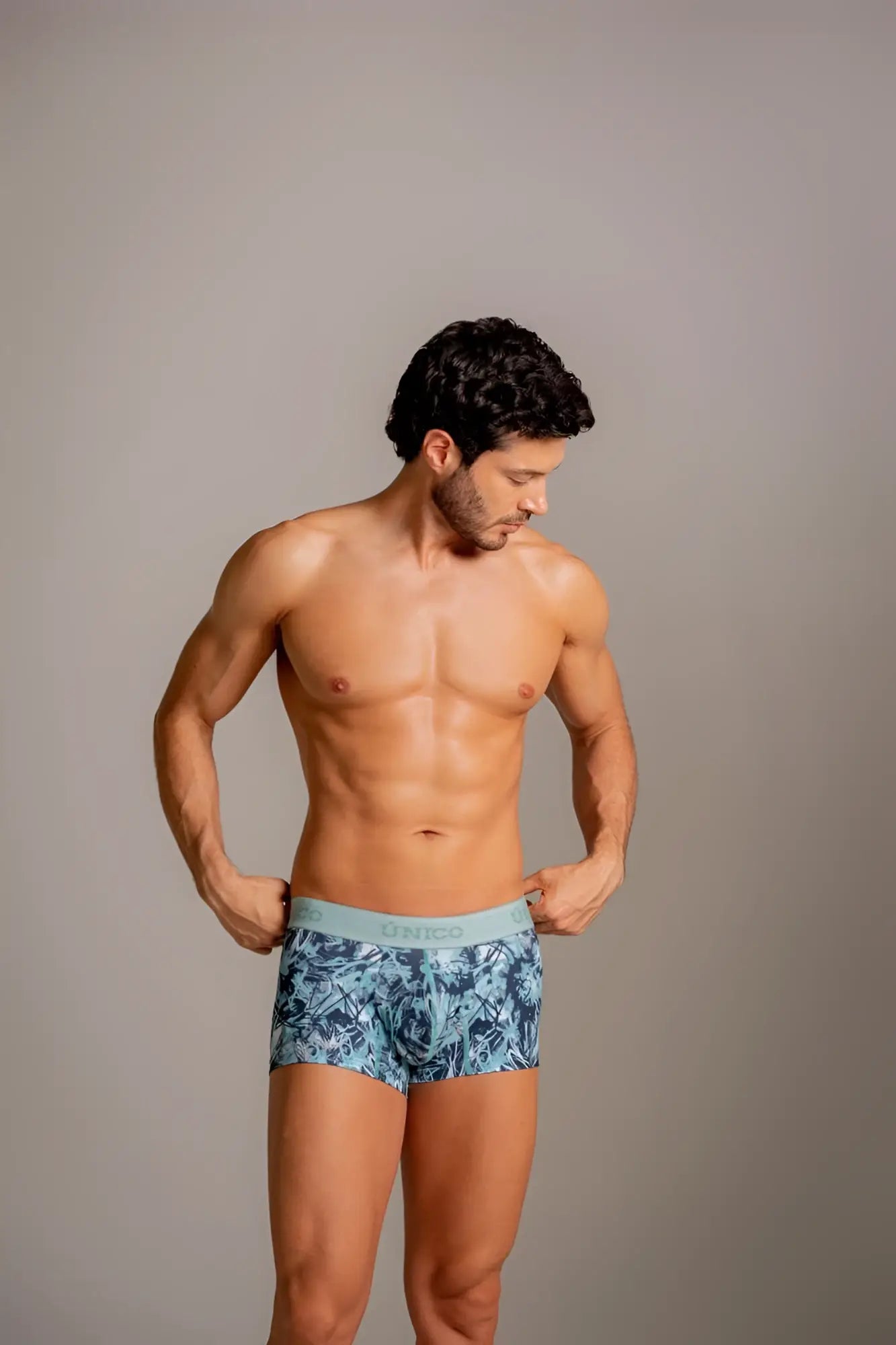 Unico 26040100112 blue and white patterned trunks with light blue elastic waistband for comfortable wear