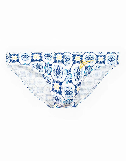 Blue and white patterned swim brief with decorative tile design ideal for beach and pool use