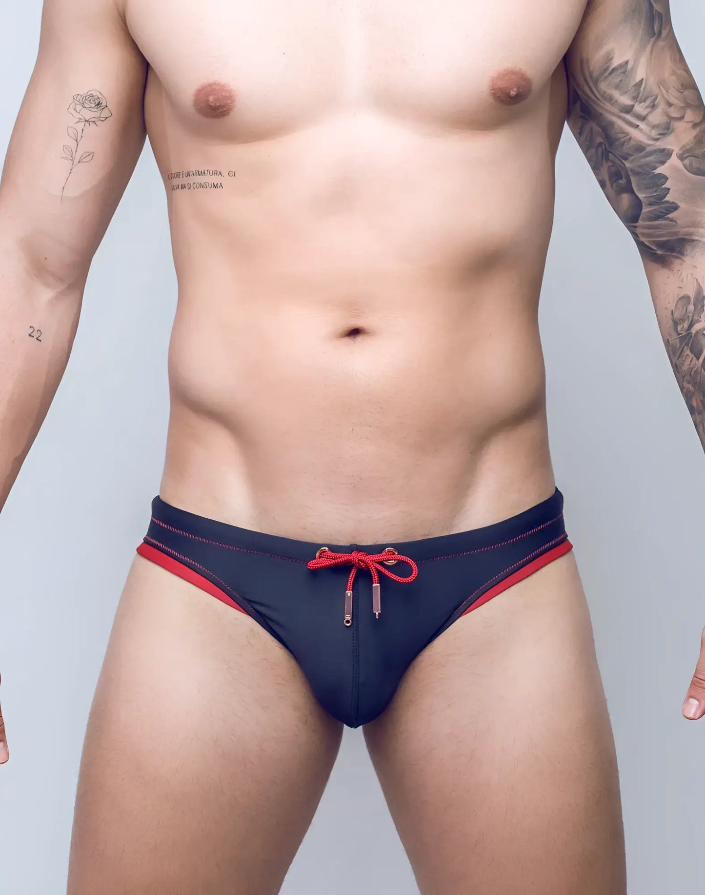V22 rapid swim brief navy blue swim trunks with red trim and matching red drawstring tie at the front
