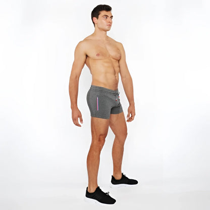 Gray vault gym-tech shorts with drawstring waist and subtle vertical stripe detailing featuring 3 color heat weld zippers
