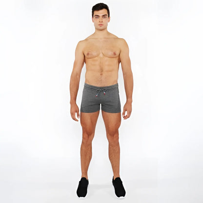 Gray heathered vault gym-tech shorts with drawstring waistband and three color heat weld red accent zippers
