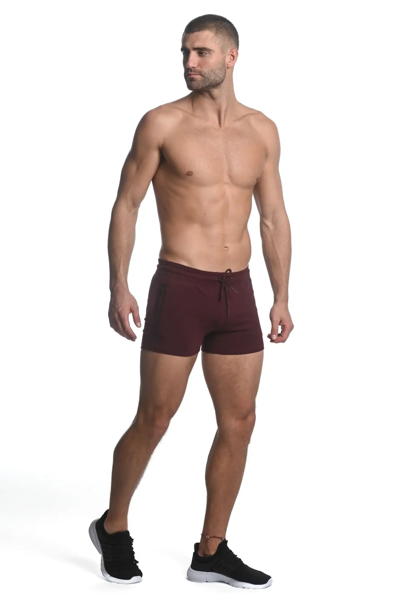 Vault gym-tech stretch shorts in maroon with black side panels and heat weld zippers for athletic use