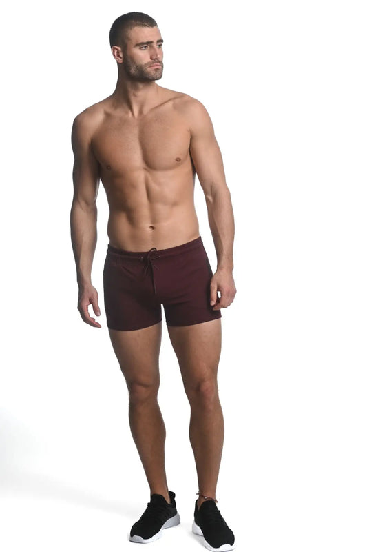 Maroon vault gym-tech stretch shorts with heat weld zippers and drawstring waistband for athletic use